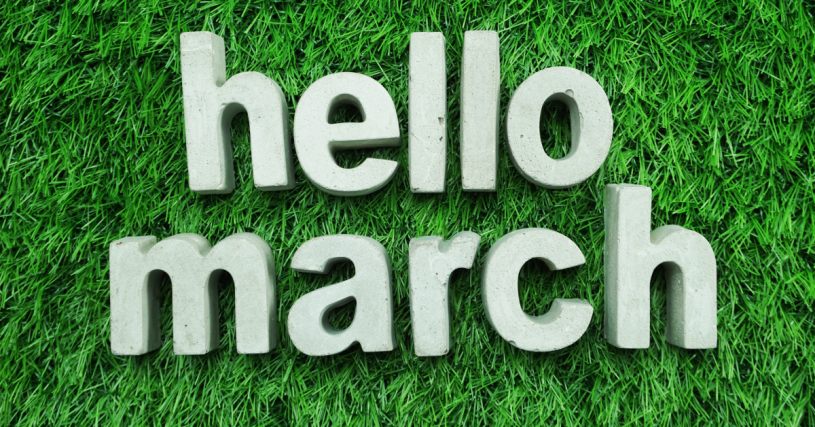 chunky letters on green grass spell "hello march"
